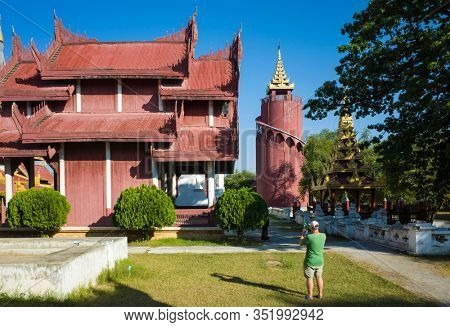 Mandalay, Myanmar - January 8, 2019: Mandalay royal Palace, Tourist taking photos of buildings inside of palace compound