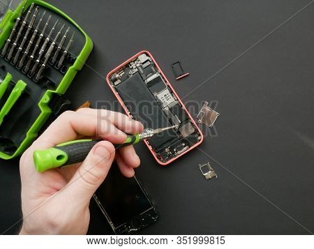 The Technician Is Fixing The Smartphone Motherboard In The Laboratory, With The Copying Area. The Co