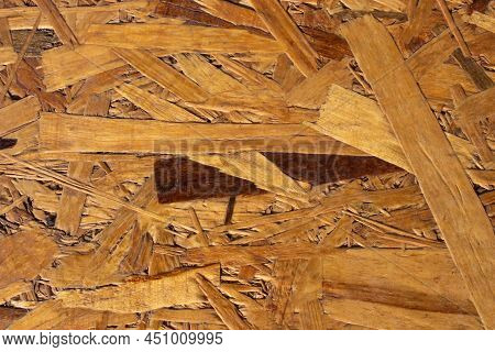 Compressed Recycled Brown Wood Chippings Board Texture. Wooden Background