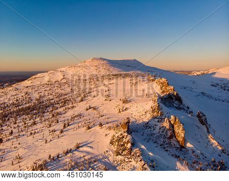 Colorful Winter Sunset In Sheregesh Ski Resort Mountains With Clouds. Aerial Top View Forest Russia
