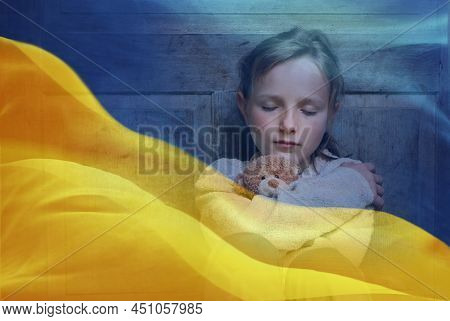 Double Exposure Of Little Girl Refugee Hodling Teddy Bear And Ukrainian Flag.