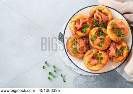 Yorkshire Pudding. Traditional English Yorkshire Pudding With Salmon And Radish Microgreens Side Dis