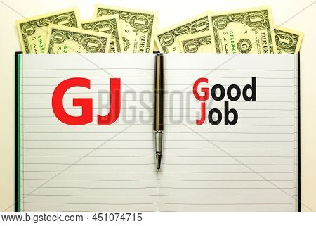 Gj Good Job Abbreviation Symbol. Concept Words Gj Good Job On White Note. Metallic Pen. Dollar Bills