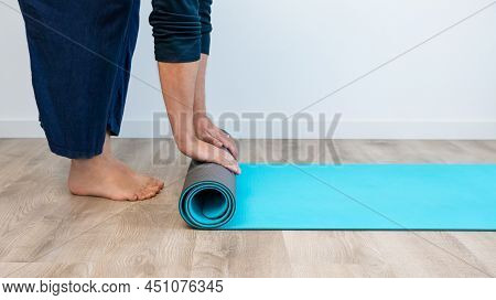 Top View Man With Exercise Mat Preparing For Yoga Sports Training In House