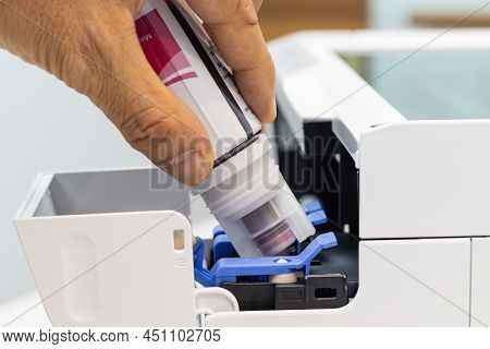 Technicians Are Installing Setup The Ink And Insert Ink Into The Fill Hole. Of An Inkjet Printer, Th