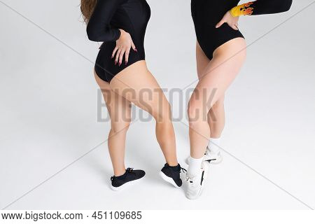 Cropped Image Of Two Sexy Twerk Dancers In Studio