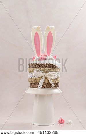 Easter Cake On A Pink Background With Hare Ears