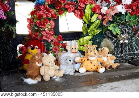 Wreaths, Flowers And Toys Near The Monument. Khatyn State Memorial Complex. Victims Of The Second Wo
