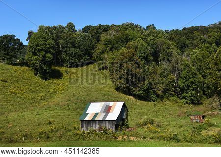 Cost Of Reroofing This Old Barn Was Off Set By Using Scrap Pieces Of New Metal To Preserve Structure