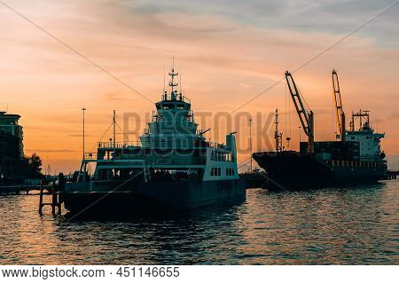 Labuan,malaysia-may 7,2016:ro Ro Ferry Ship And Cargo Ship With Container In The Labuan Port Of Labu