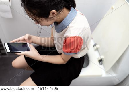 Asian Schoolgirl Using Cell Phone Chat Send Messages Sit On Toilet Bowl During Study Hours,lazy Lady
