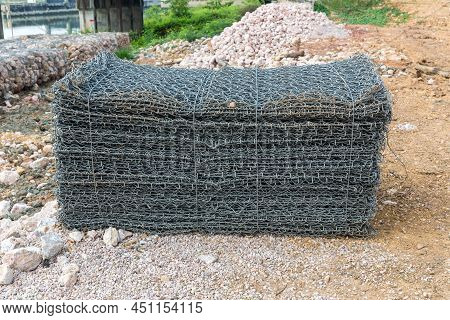 Textured Mesh - Gabion To Strengthen The Slope. A Pile Of Iron Wire Or Also Known As \'gabion\'. Gal