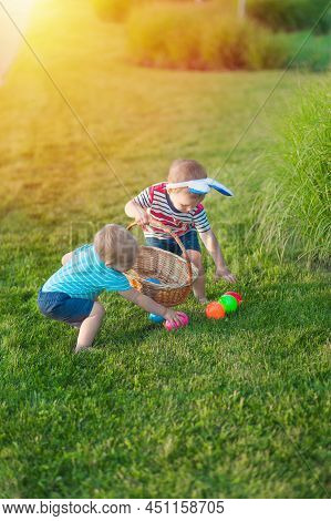 Toddler Eggs Hunters Close-up. Children Activity For Easter In Nature..