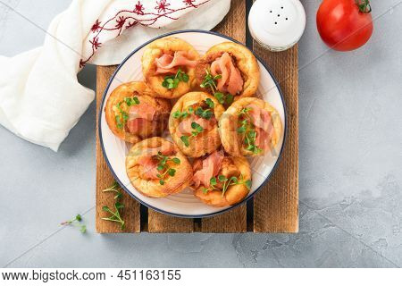 Yorkshire Pudding. Traditional English Yorkshire Pudding With Salmon And Radish Microgreens Side Dis