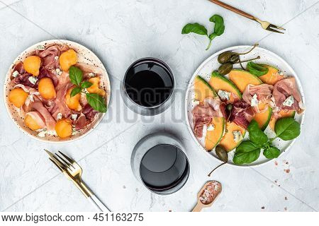 Fresh Melon With Prosciutto And Basil. Antipasti, Traditional Spanish And Italian Appetizer. Top Vie