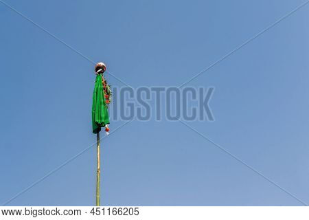 Gudhi Padwa Festival Celebration By Standing The Bamboo Gudhi Flag Of Silk Cloth With Garland And Up
