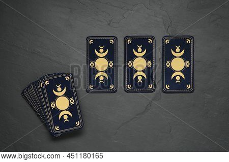 Tarot Cards On Black Table, Flat Lay. Reverse Side