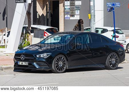 Antalya; Turkey - March 04 2022:    Black Mercedes-benz Cla-class  Is Parking  On The Street On A  S