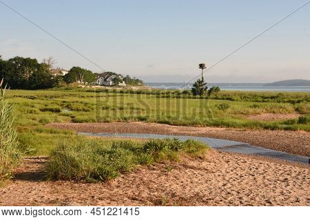 Scenic Coastal Views With An Osprey Nest In The Distance.