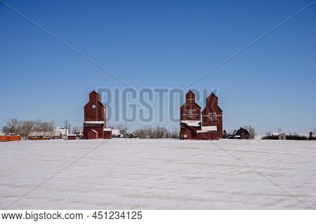 Rowley, Alberta - March 6, 2022: Grain Elevators In The Ghost Town Of Rowley In Winter.