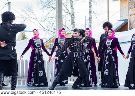 Caucasian Dances. International Holiday Navruz, March 21, 2022 Russia, Tomsk. Men And Women Dance In