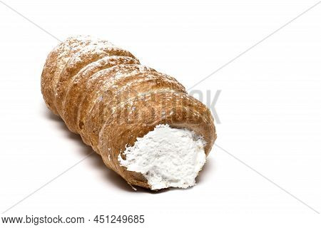 Close Up Of One Foam Roll Traditional Sweet Dessert From Austria Made Of Puff Pastry With Sugar Whip