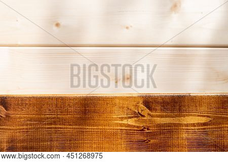 Applying Varnish Paint On A Wooden Surface. Painting Wood Wall And Floor.wooden Boards Are Half Cove