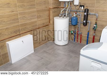 A Modern Gas Boiler For Natural Gas, Installed In A Boiler Room Lined With Ceramic Tiles, Visible 12