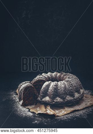 Delicious Chocolate Cake. Cupcake On A Dark Table. Chocolate Biscuit. 
Traditional Christmas Cake Pu