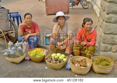 Woman sells fruit on the street
