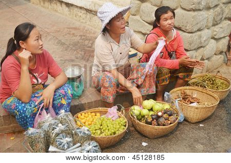 Woman sells fruit on the street