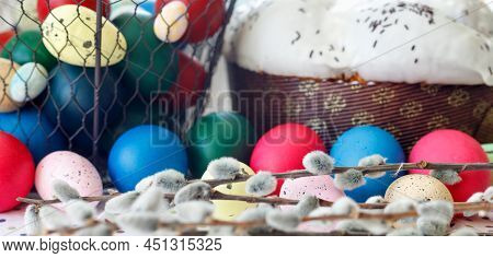 Easter Cake With Glace Icing And Easter Eggs On White Lace Tablecloth.  
Traditional Christian Easte