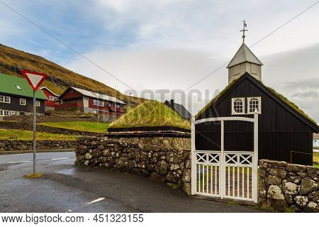View Of The Kollafjordur Church, Kirkja In Small Village On Streymoy Island. Cloudy Day. Kollafjordu