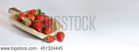 Decorative Wooden Scoop With Strawberries, Two Berries On The Side. Banner