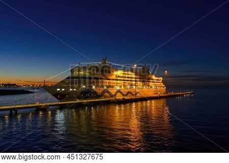 Tallinn, Estonia -march 19, 2022: Aida Cruise Ship At Night In Terminal. Aida Luxury Liner In Bright