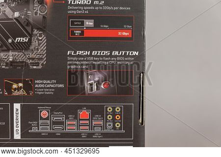 Msi B450 Mortal Max Motherboard Against A Gray Background. Black Box With The New Computer Hardware.