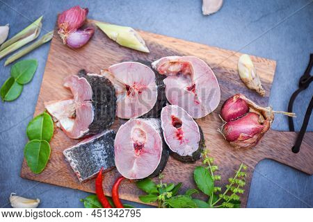Striped Snakehead Fish Chopped With Ingredients Herb And Spices On Wooden Cutting Board And Table Ki