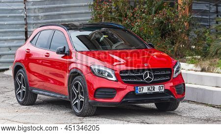 Side; Turkey - March 03 2022:    Red  Mercedes-benz Gla  Is Parked  On The Street On A Warm    Day ,