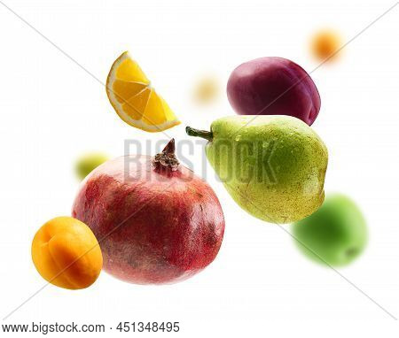 Fresh Fruits Levitate On A White Background