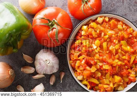 Homemade Sofrito Sauce From Peppers, Tomatoes, Garlic And Onions Close-up In A Plate On The Table. H