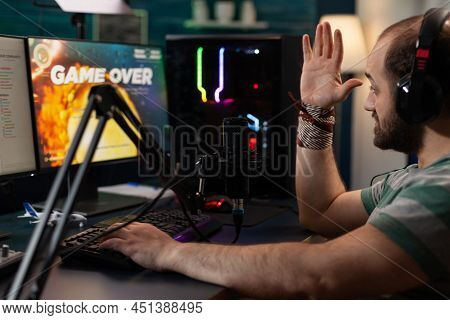 Player Losing Video Games On Online Stream With Live Chat. Man Streaming Gameplay On Computer With H