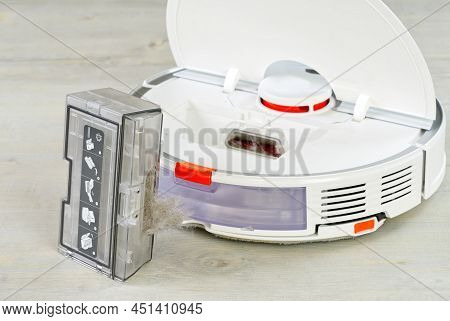 Robot Vacuum Cleaner Water Tank Removed And The Filter Lid Is Opened To Clean. Smart Cleaning And Wa