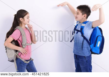 Happy Boy And Girl Satanding And Talking