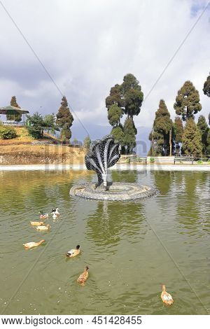 Secret Jore Pokhari Lake Surrounded By Pine Forest And Mythological Snake Statue In The Middle Of Th