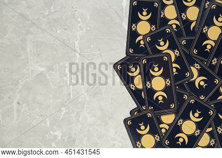 Tarot Cards On Grey Table, Top View And Space For Text. Reverse Side