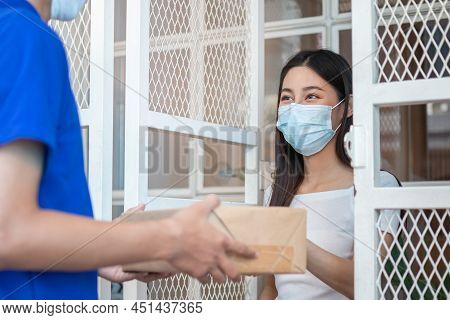 Asian Young Woman, Customer Wear Face Mask Protect To Pandemic Of Covid-19 Or Coronavirus, Received 