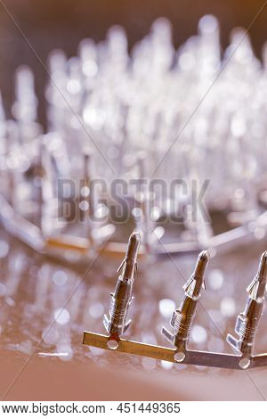 Electronic Concepts. Line Of Silver Tinned External Pcb Angular Connectors Over White Background