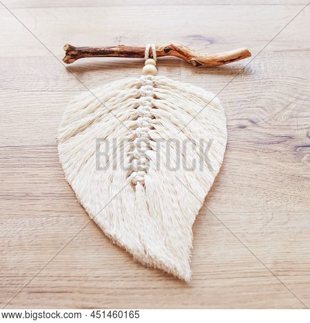 Macrame Leaf  In Natural Color On A Wooden Table. Cotton Rope Decor Macrame To Make Your Room More C
