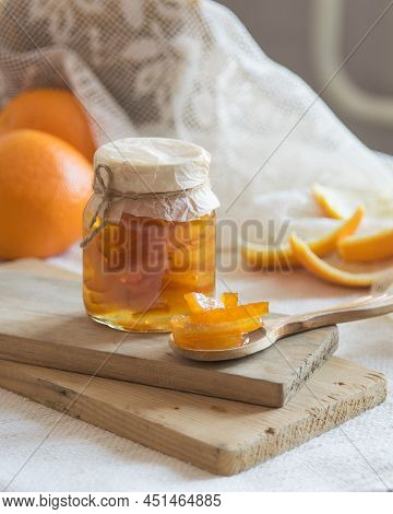 Homemade Candied Peels Orange Confiture In Glass Jar On Light Background, Selective Focus
