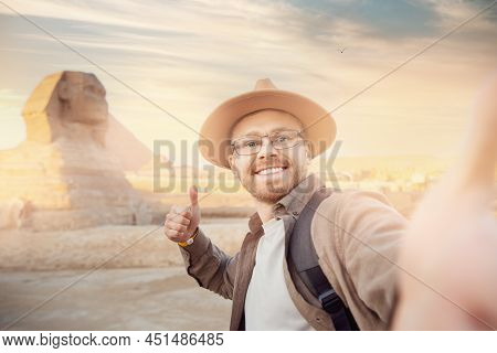 Travel Selfie Photo Man In Hat Background Pyramid Of Egyptian Giza And Sphinx, Sunset Cairo, Egyp